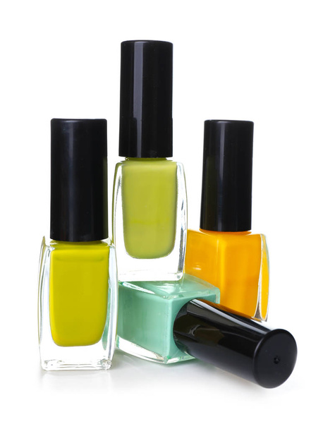 Bottles of colorful nail polishes on white background - Photo, Image