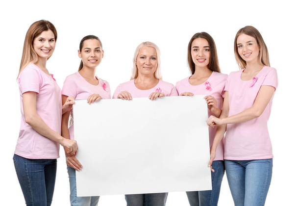 Beautiful women of different ages with pink ribbons holding poster on white background. Breast cancer concept - Photo, image