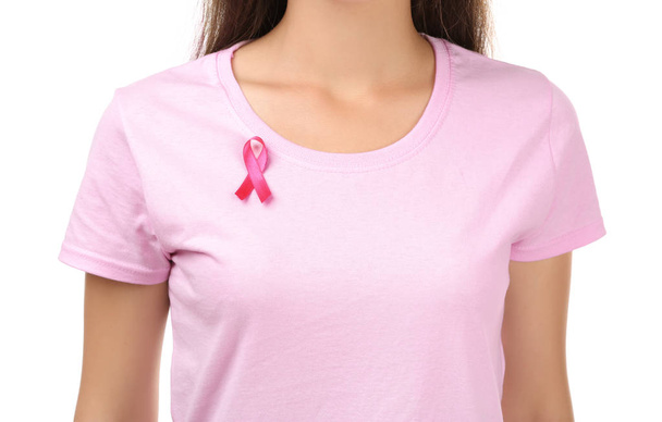 Beautiful woman with pink ribbon on white background, closeup. Breast cancer concept - Fotografie, Obrázek