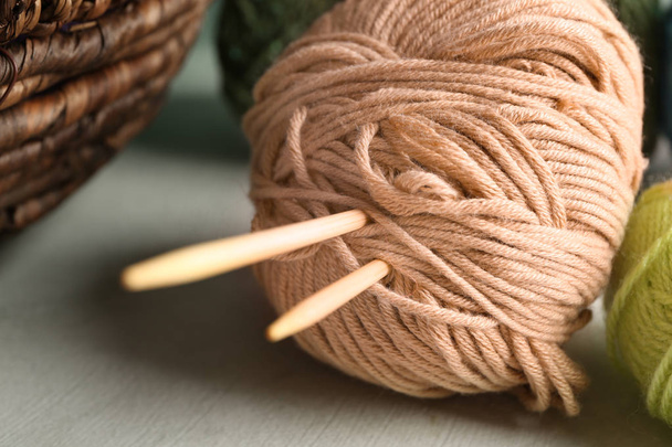 Balls of knitting yarn with needles on table, closeup - Photo, Image