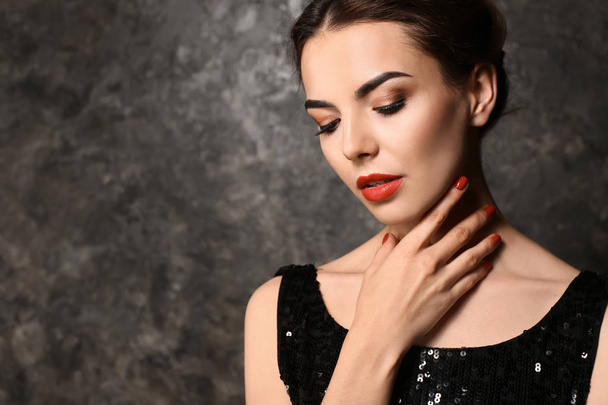 Young woman with beautiful manicure on dark background - Fotografie, Obrázek