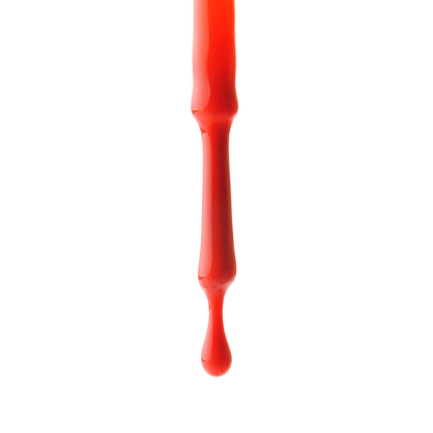 Brush with dripping nail polish on white background - Foto, immagini