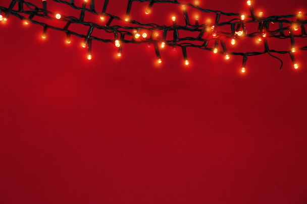 Beautiful bright Christmas garland on color background - Zdjęcie, obraz
