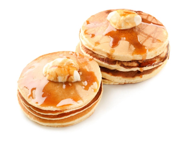 Tasty pancakes with butter and honey on white background - Photo, Image