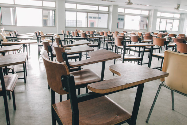 Old scattered chairs in the classroom. - Photo, Image