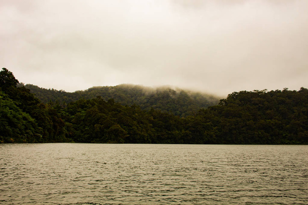 Two identical mountain lakes that are on top of the mountains on the island of Negros. Fog. - Photo, Image