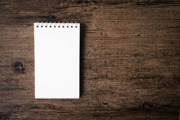 Top view image of open notebook with blank page on the wooden table - Photo, Image