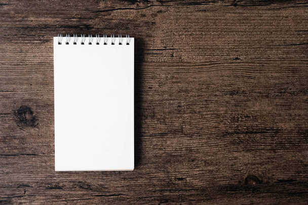 Top view image of open notebook with blank page on the wooden table - Photo, Image