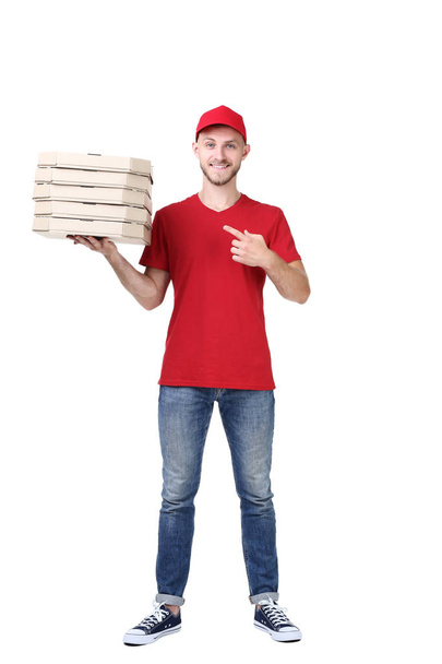 Delivery man with pizza on white background - Photo, image
