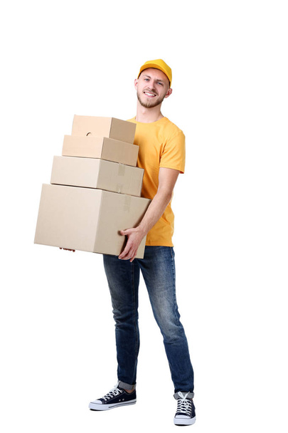Delivery man with cardboard boxes on white background - Φωτογραφία, εικόνα