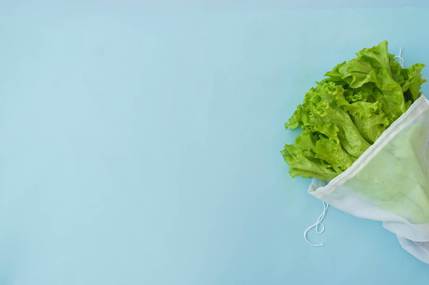 grocery cotton bag with salad, zero waste concept  - Фото, изображение