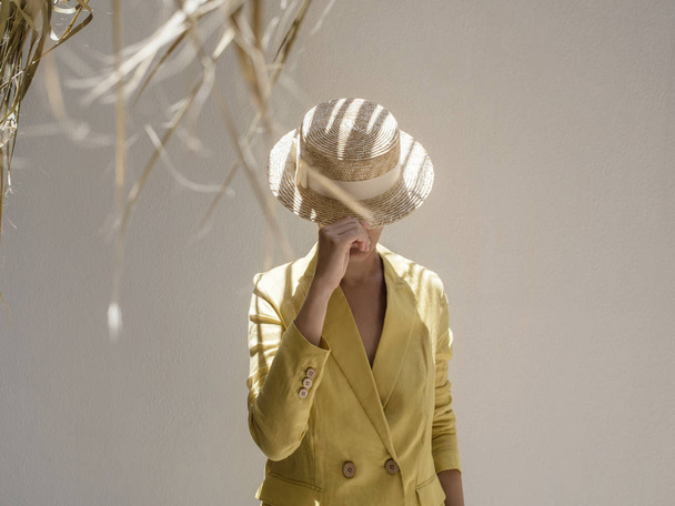 Unrecognizable woman in straw hat. - Fotoğraf, Görsel