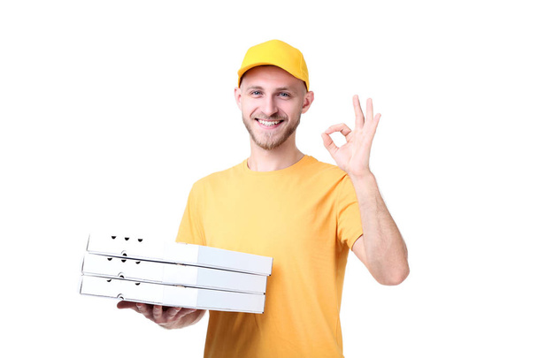 Delivery man with pizza on white background - Valokuva, kuva