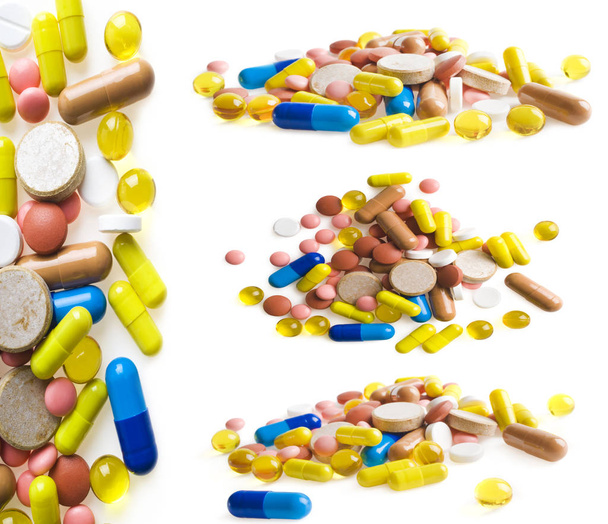set of multi-colored tablets and capsules on white background - Fotoğraf, Görsel