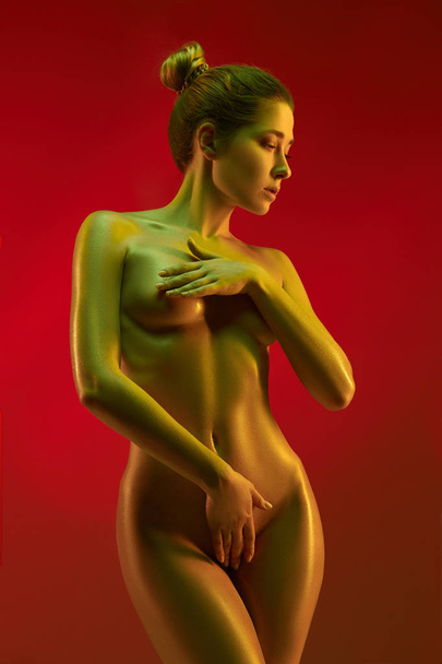 fashion art photo of elegant nude model in the light colored spotlights - Photo, image