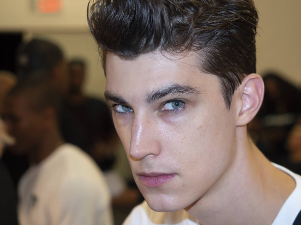 New York, NY, USA - July 9, 2018: A model prepares backstage for Carlos Campos Spring/Summer 2019 collection during NY Fashion Week: Mens at Industria Studios, Manhattan - Foto, imagen