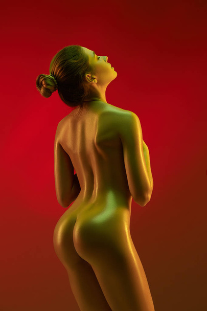 fashion art photo of elegant nude model in the light colored spotlights - Foto, immagini