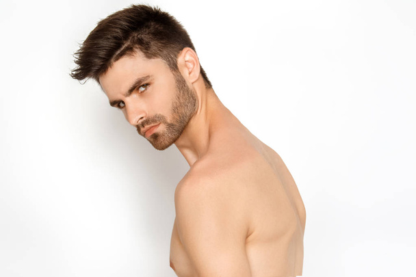 Stripped strong face guy in black underwear on white background in studio isolated - Foto, Imagen