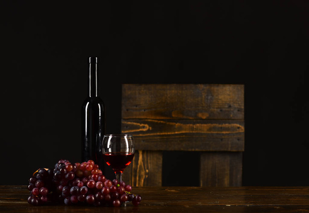 Winetasting and degustation still life concept. Set of dark grapes, - Zdjęcie, obraz