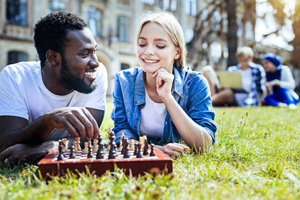 Relaxed friends enjoying chess game together - Photo, Image
