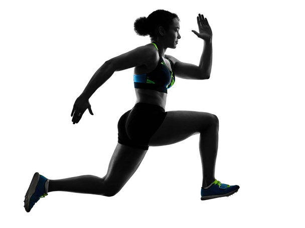 african runner running sprinter sprinting woman isolated white b - 写真・画像