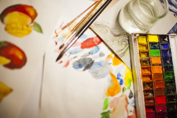 White background with paints, watercolor, brushes, water in a jar and a palette - Fotoğraf, Görsel