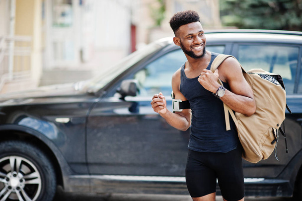 African american male athlete sport man with backpack against his black suv car before training. - Φωτογραφία, εικόνα