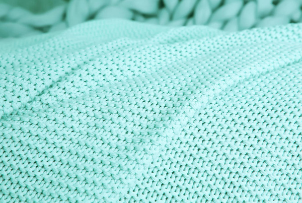 Texture of warm knitted mint blanket, closeup - Photo, image