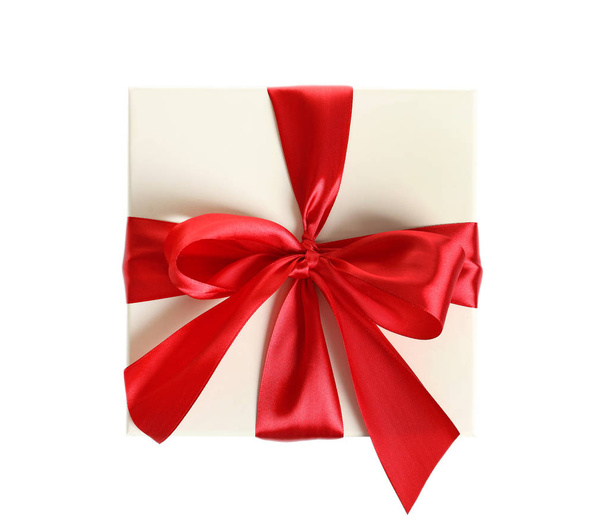 Gift box with ribbon on white background, top view - Foto, immagini