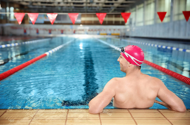 Young athletic man in swimming pool - Фото, зображення