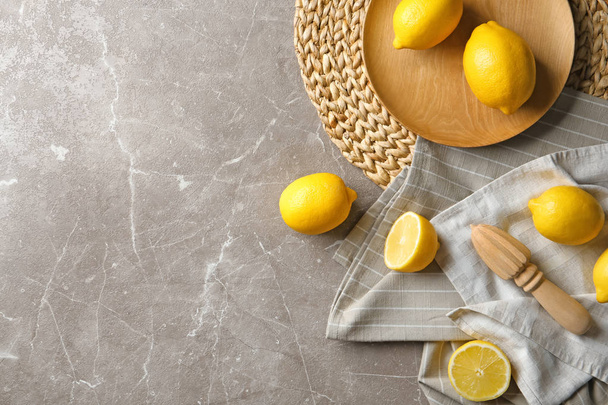 Flat lay composition with lemons on color background - Фото, зображення