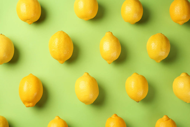 Flat lay composition with fresh ripe lemons on color background - Фото, изображение