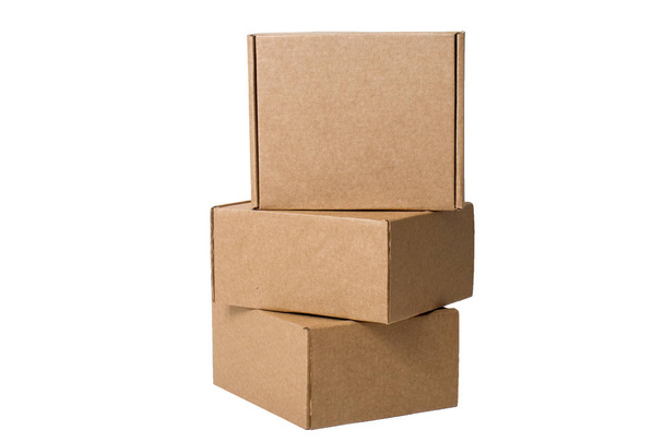 Delivery, moving, package and gifts concept - pile of stacked self-gathering cardboard boxes isolated on white background. mock up - Photo, Image