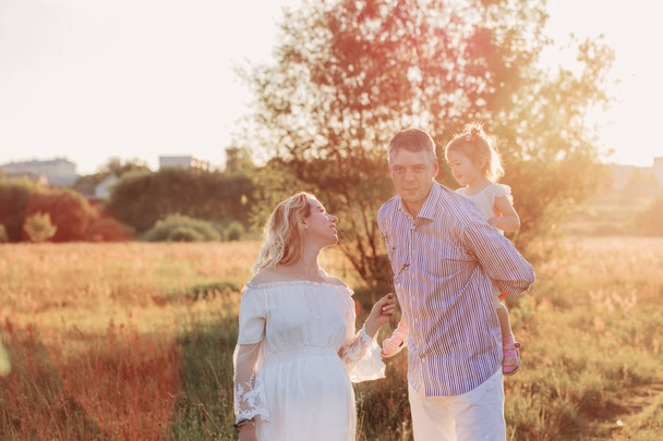 happy family in summer park at sunset - Photo, Image