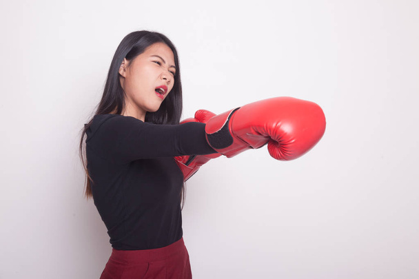 Young Asian woman with red boxing gloves on white background - Foto, afbeelding