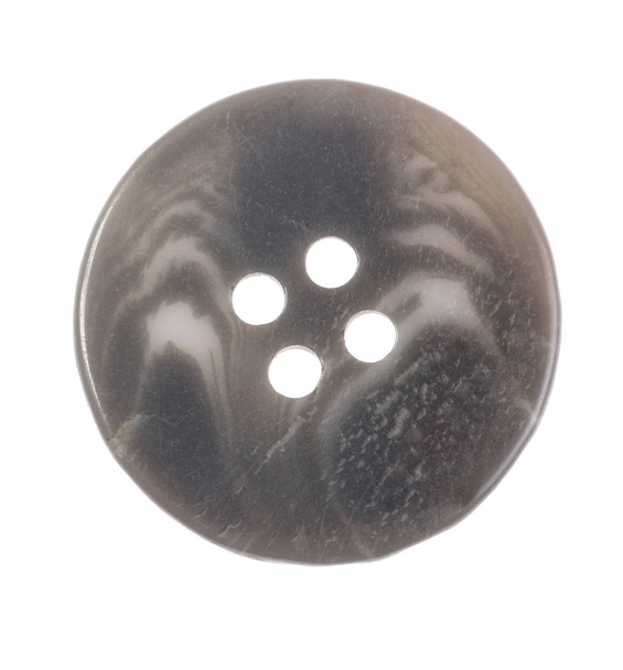 bouton simple gris avec quatre trous isolés sur fond blanc
 - Photo, image