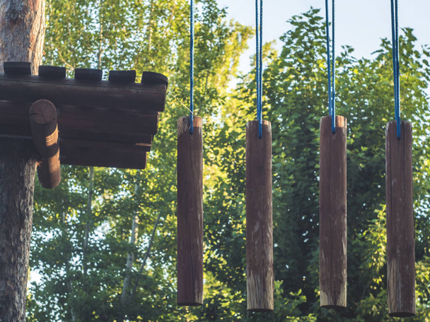 rope park wooden bars hang on the ropes obstacle healthy lifestyle - Foto, imagen