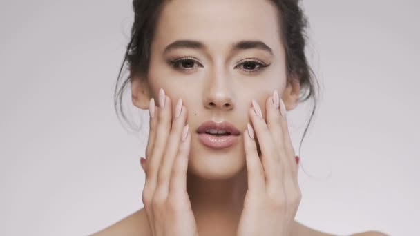 Attractive brunette model at studio background - Video, Çekim