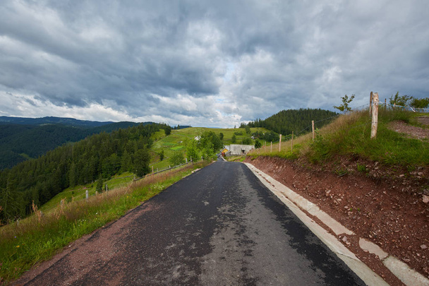 Landscape with an empty road into the mountains - Fotó, kép