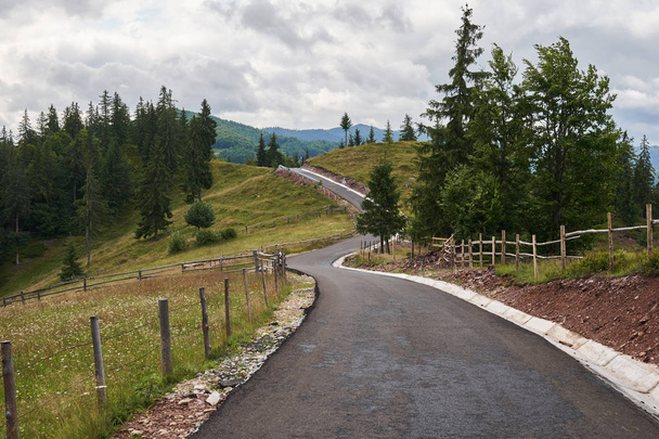 Landscape with an empty road into the mountains - Fotó, kép