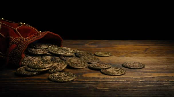 Bag Of Coins On Wooden Table - Footage, Video