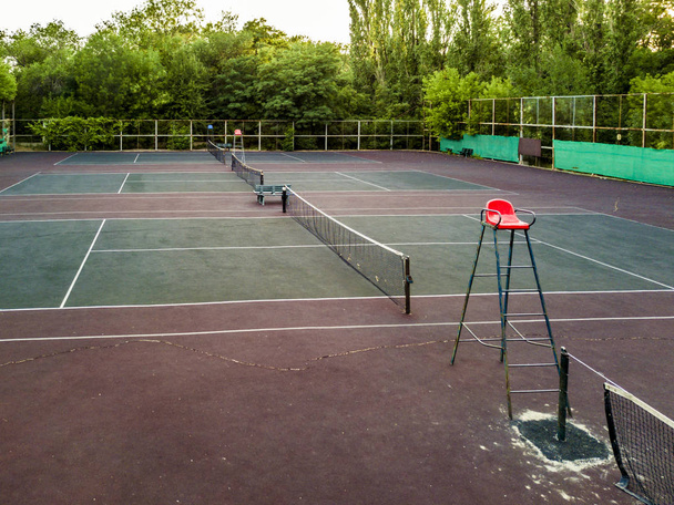 aerial multiple empty tennis courts in the green trees forest sport concept - Photo, Image