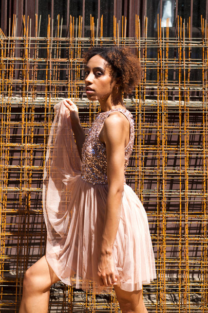 Street fashion model. Portrait of an African young woman in pink dress - Fotografie, Obrázek