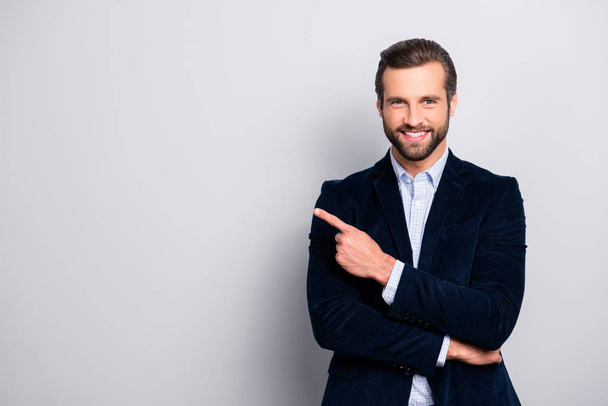 Portrait of cheerful excited joyful satisfied handsome attractive fashionable macho guy dressed in formal outfit dark velvet pointing on empty blank copyspace isolated on gray background copy-space - Fotoğraf, Görsel