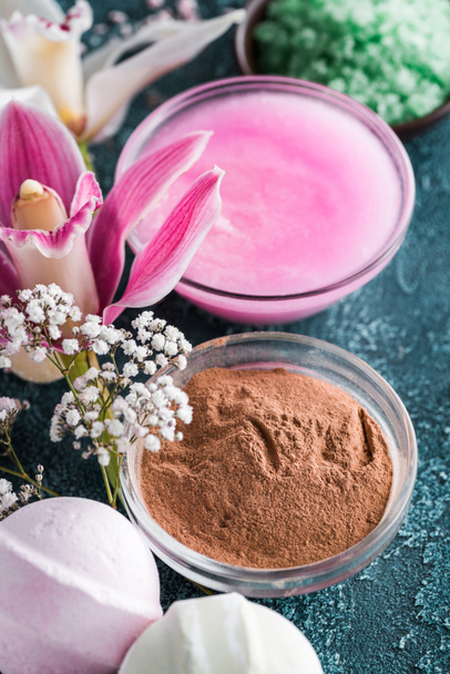 close-up view of beautiful tender flowers, homemade soap and lotion, spa treatment concept  - Photo, Image