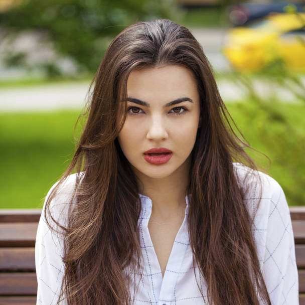 Portrait close up of young beautiful brunette woman, summer outdoors - Photo, Image