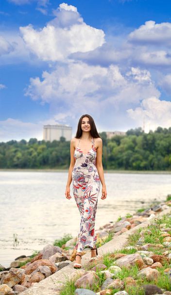 Sexy young brunette walking in summer park - Photo, image