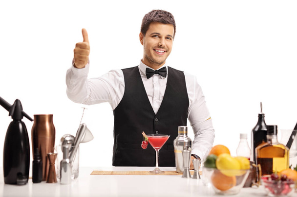 Bartender making a thumb up sign isolated on white background - Foto, immagini