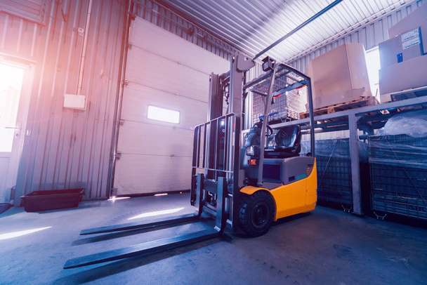 Forklift loader. Pallet stacker truck equipment at warehouse. Background - Fotografie, Obrázek