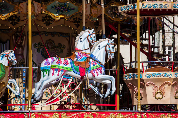 Horses of a French old-fashioned style carousel with stairs in Avignon France - Photo, Image